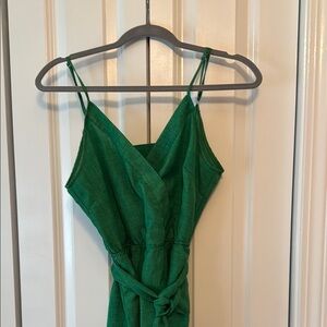 Green Sleeveless pantsuit with snap front closure, belt and sexy back cut out